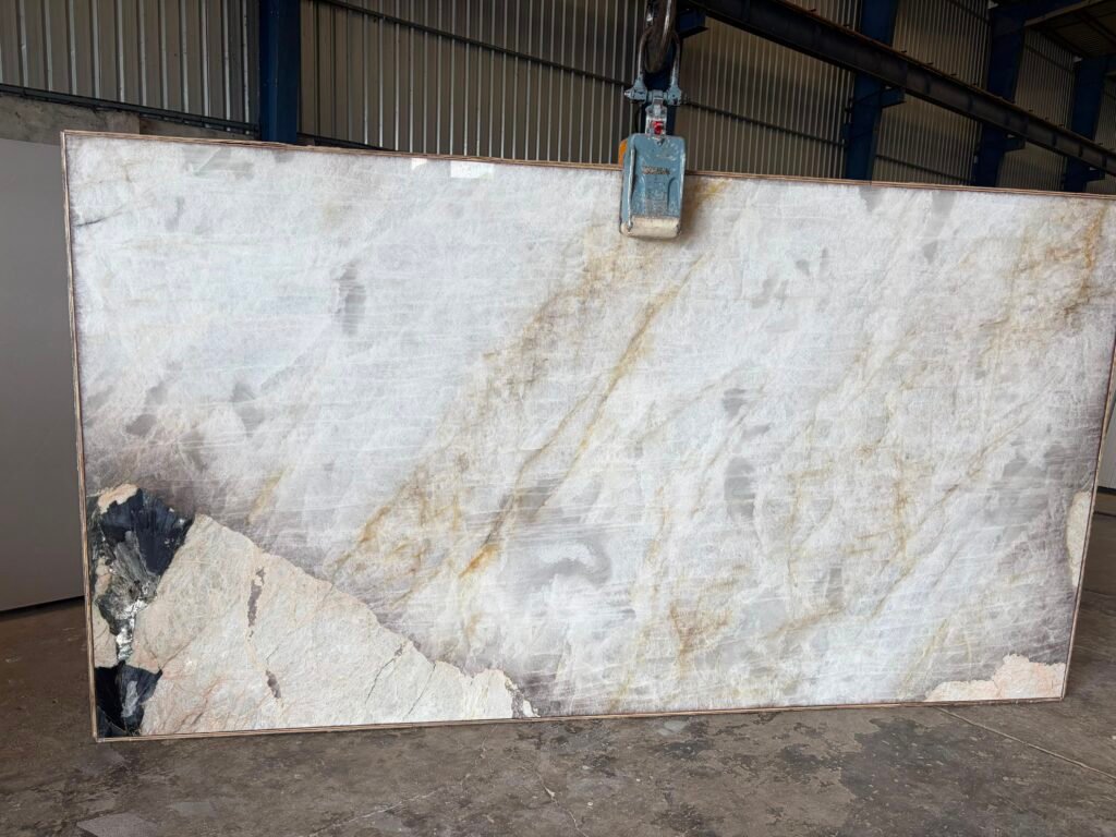 Full Patagonia Gold quartzite slab standing in the KJM Stones yard in Buda TX, a natural stone buying guide tip: always view the whole slab