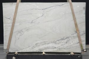 White quartzite slab with dramatic blue-gray and charcoal veining by KJM Stones
