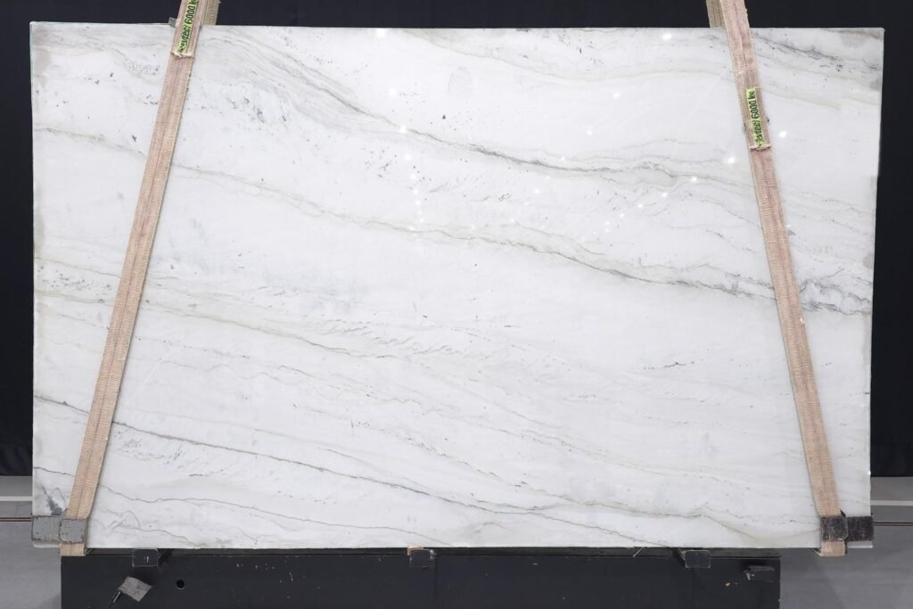 Full Bellagio quartzite slab with soft gray veining, viewed standing up at KJM Stones