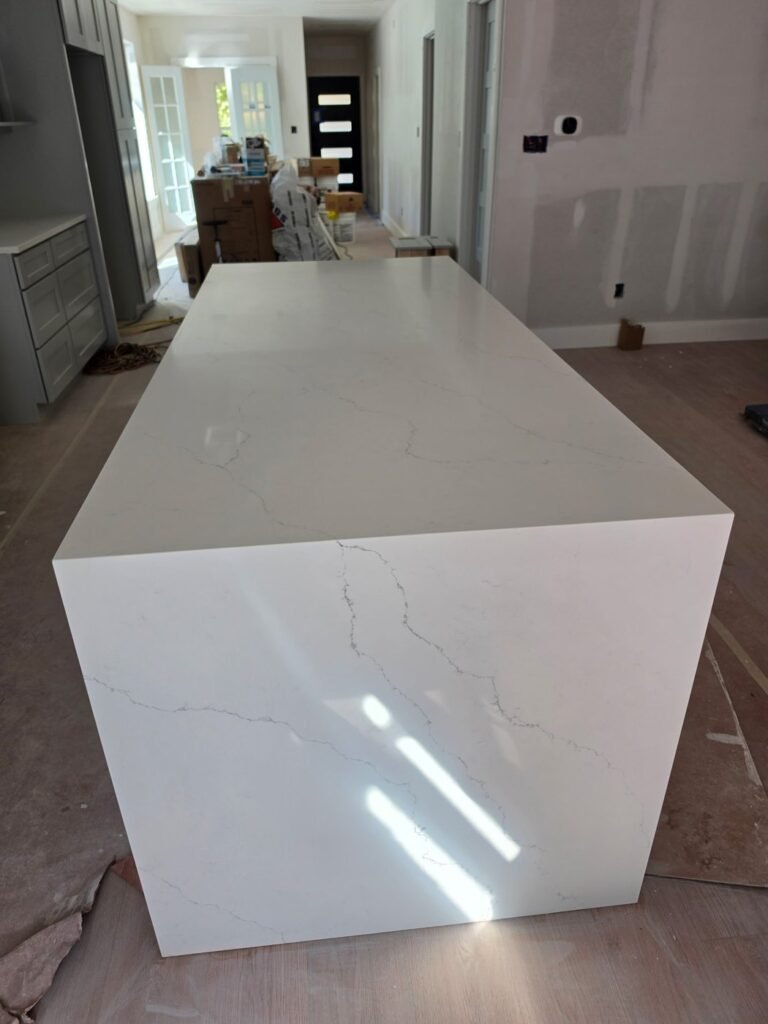 Calacatta Riviera quartz island with a waterfall end panel
