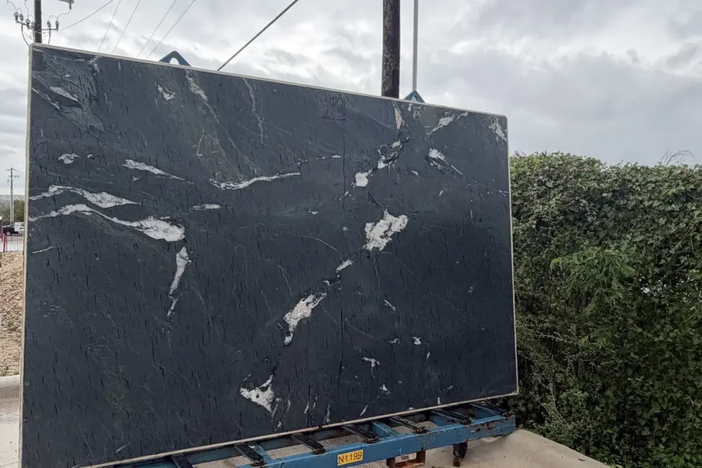 Black granite slab with bold white veining — KJM Stones, Buda TX