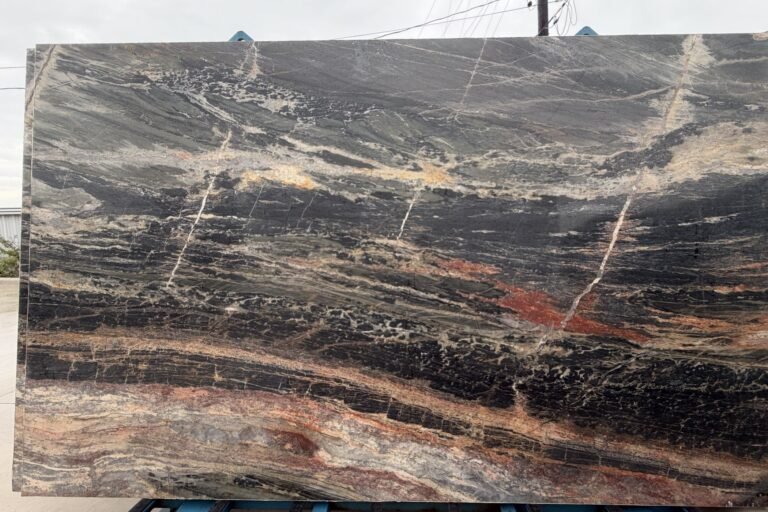 Exotic black and red quartzite slab with flowing movement — KJM Stones, Buda TX