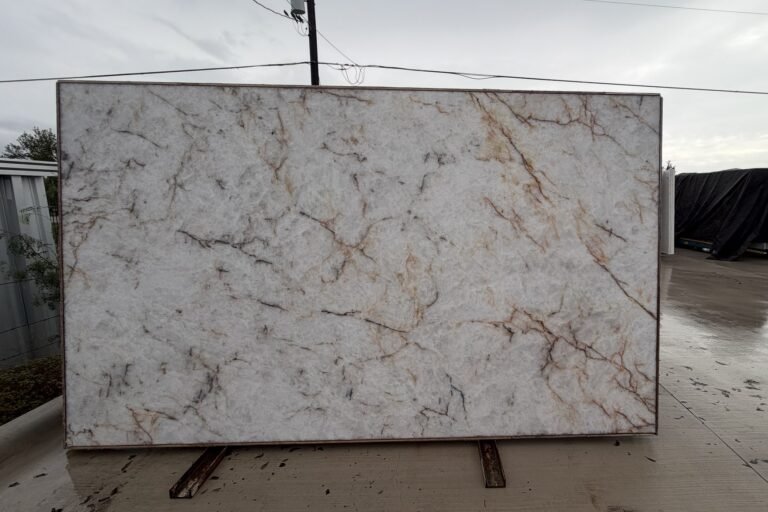 White quartzite slab with warm gold veining — KJM Stones, Buda TX