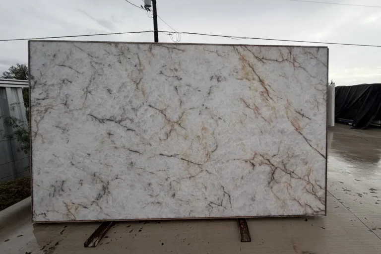 White quartzite slab with warm gold veining — KJM Stones, Buda TX
