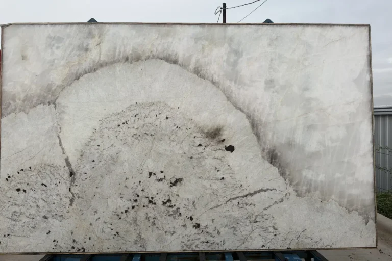 White quartzite slab with dramatic natural veining — KJM Stones, Buda TX