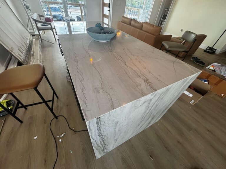 Mykonos quartzite waterfall island with grey veining running down the end panel